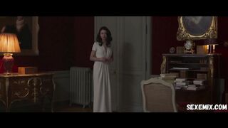 Wet Olga Kurylenko in a white dress, scene in Les traducteurs