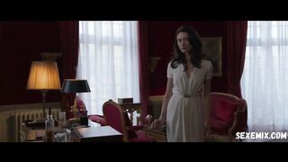 Wet Olga Kurylenko in a white dress, scene in Les traducteurs