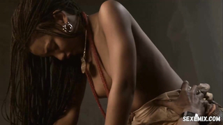 Rungano Nyoni shows bare breasts, scene in Iron Doors (2010)